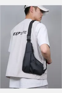 Detailed view of the slim black crossbody bag with adjustable strap and quick-release buckle