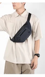 Detail view of large capacity navy nylon crossbody chest bag with adjustable strap