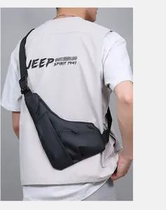 Rear view of sleek black crossbody chest bag with adjustable strap and buckle on male model