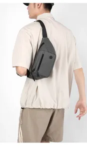 Close-up of gray multi-pocket chest bag with high-density nylon and adjustable strap