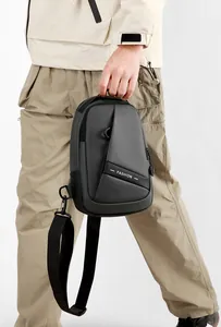 Detail of waterproof Oxford fabric and zipper pockets on this grey men's crossbody chest bag