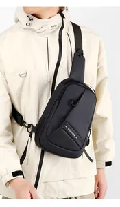 Black Oxford fabric crossbody chest bag for men styled on a model for urban outdoor activities