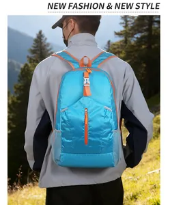 Blue lightweight foldable outdoor backpack with orange zippers for mountain hiking