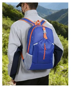 Blue ultra-lightweight foldable hiking backpack shown worn in a sunny forest setting