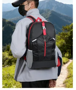 Detail of lightweight outdoor backpack with breathable mesh and red adjustable straps