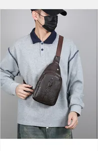 Brown crocodile texture faux leather chest bag showing embossed skin on male model