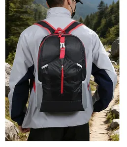 Detailed view of lightweight hiking backpack with red straps and side mesh pocket