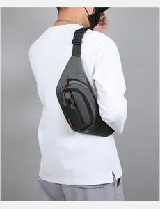 Detail showing the adjustable buckle and padded straps of the grey outdoor waist pack
