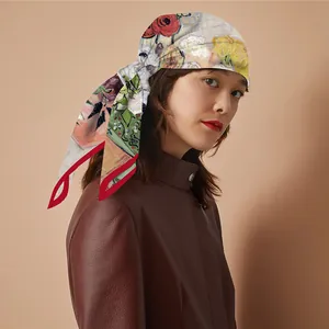Close-up of Van Gogh style oil painting floral silk scarf with red roses and green leaves