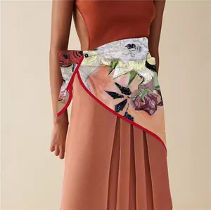 Detailed view of Van Gogh style floral silk scarf styled as an elegant waist accessory