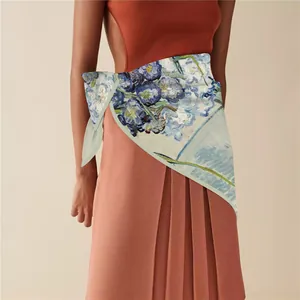 Detail of van Gogh style scarf worn as a waist belt on a pleated skirt outfit
