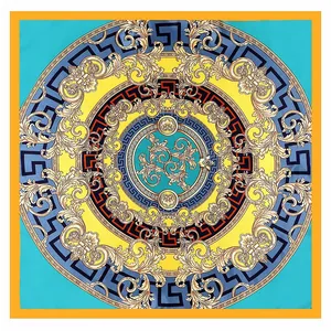 Baroque style silk scarf with blue and gold geometric patterns in a flat lay view