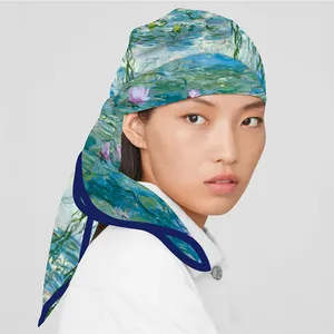 Monet Water Lilies print silk scarf as a headscarf wrap for women on grey backdrop