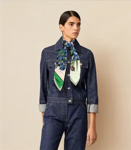 Detailed view of Van Gogh Iris art print silk scarf tied elegantly around a model neck