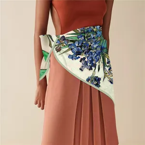 Detailed shot of Van Gogh iris silk scarf styled as an elegant waist tie on model