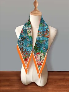 Detail of French floral diamond scarf with tropical garden print and orange edges