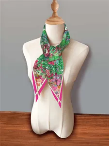 Detail of French floral diamond scarf with tropical garden print and vibrant jungle motifs