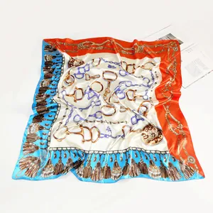 90cm square silk scarf featuring equestrian horseshoe chain print and orange tassels