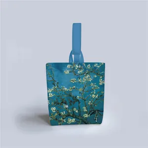 Close-up of artistic Van Gogh almond blossom print on a casual fabric tote bag