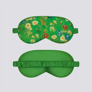 Detail of oil painting floral sleep mask showing smooth satin texture and elastic strap