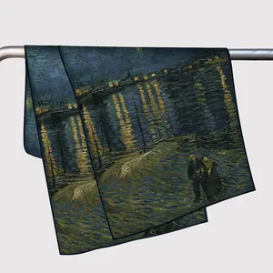 Van Gogh Starry Night silk-textured scarf draped on a metal rod with deep blue hues