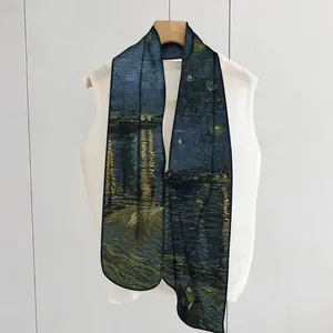 Detailed view of Van Gogh Starry Night silk scarf featuring deep blue and yellow artistic tones