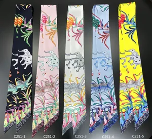 Detailed close-up of five colorful elephant pattern twilly silk scarves for bags