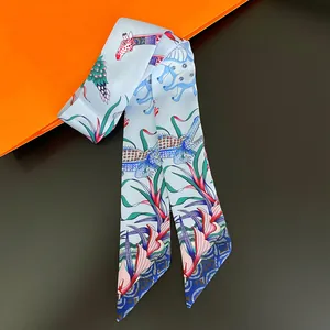 Artistic silk twilly scarf with light blue exotic animal patterns and floral illustrations
