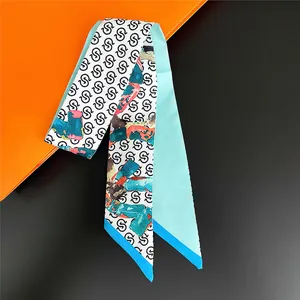 Elegant white silk twilly scarf with black S-letter pattern and vibrant color blocks