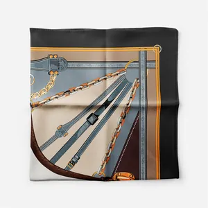 Detail of elegant square scarf featuring equestrian chain and leather strap patterns