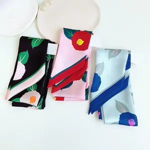 Floral silk scarves set in pink, blue, and black with elegant camellia patterns