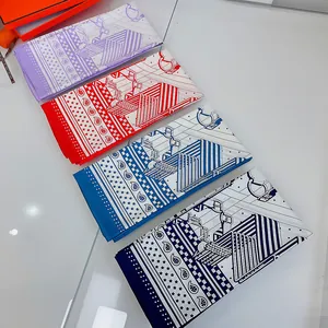 Detail of four silk square scarves with equestrian horse motifs and hand-rolled edges