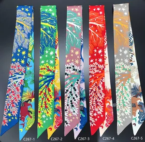 Detailed flat lay of five floral and animal print narrow polyester neck scarves in multiple colors