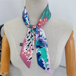 Detailed view of artistic jungle animal print polyester scarf tied around a mannequin neck