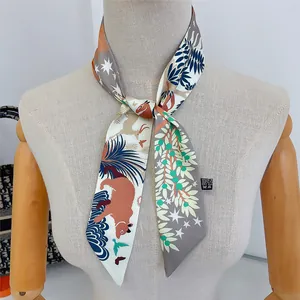 Polyester twilly scarf with animal totem motifs styled on a mannequin neck