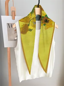 Close-up of Van Gogh sunflower print silk scarf with refined stitching on white vest