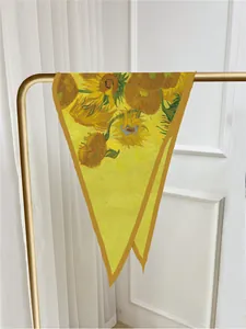 Detailed macro view of yellow Van Gogh sunflower print on a silk-like twill diamond scarf