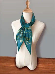 Detailed close-up of Van Gogh almond blossom print silk scarf on a beige mannequin bust