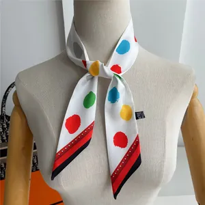 Detailed view of colorful polka dot long silk ribbon made of 100% premium polyester