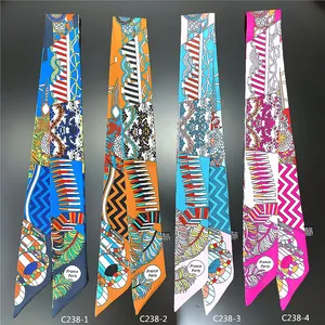 Close-up of four floral twilly scarves with intricate patterns and French Paris logo