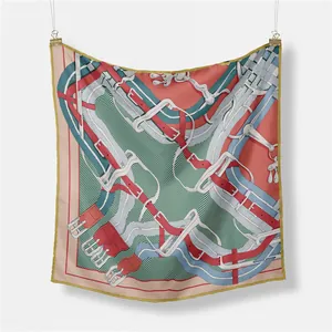 French vintage silk scarf with horse harness pattern and gold trim on white background