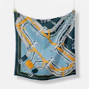 French vintage silk scarf featuring equestrian motifs of bridles and buckles on navy background