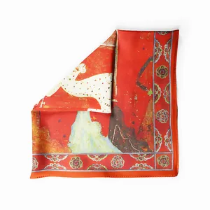 Close-up of Dunhuang style silk scarf with a white deer illustration and red floral borders