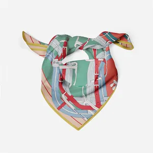 Detail of equestrian silk scarf showing leather strap patterns and hand-rolled yellow edges