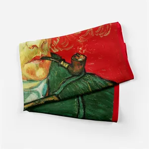 Detailed close-up of Van Gogh self-portrait oil painting print on red silk scarf edge