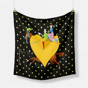 Detail of a black and yellow heart patterned silk scarf featuring romantic palace lovers
