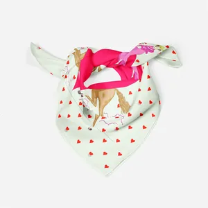 Detail of light green silk scarf featuring red hearts and artistic female illustration