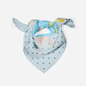 Detail of silk-textured light blue square scarf featuring pink horse and heart patterns