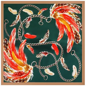 Green silk square scarf with golden chains and vibrant feather print for women