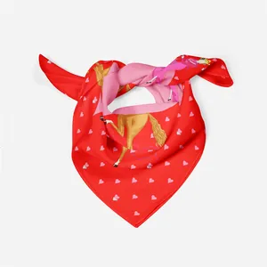 Detail of red and pink silk scarf with hand-painted horse and heart pattern knot